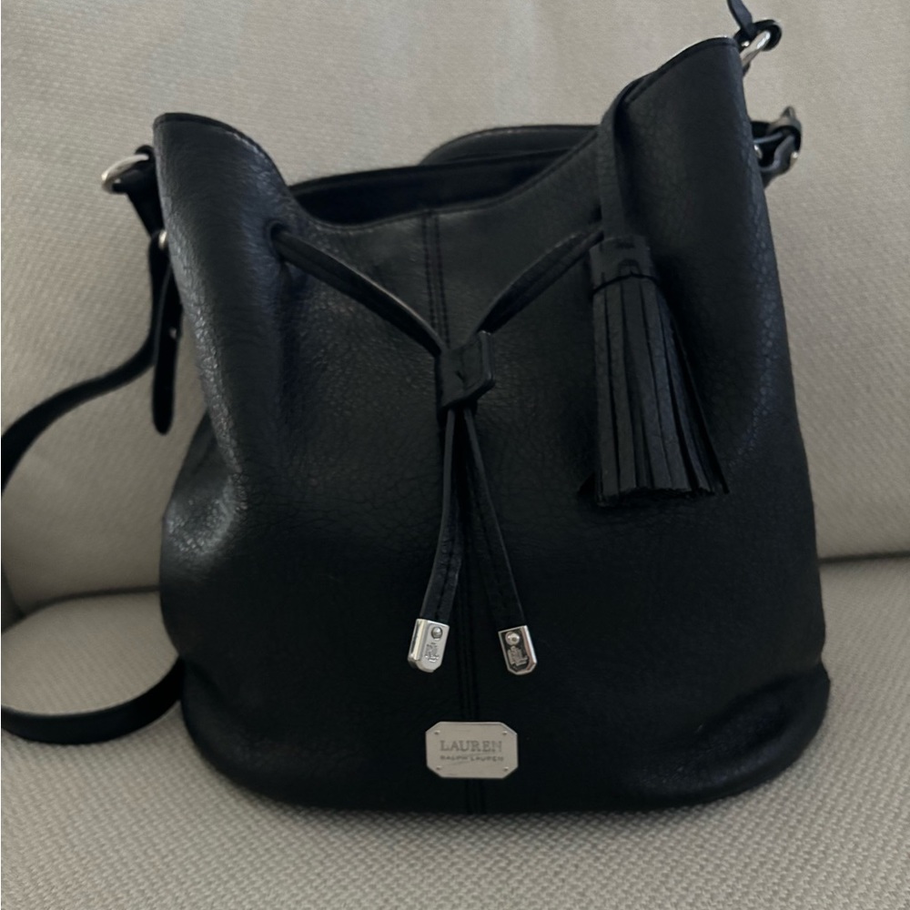 Handbag, subtle, soft black leather purse. Inside snap closure and drawstring